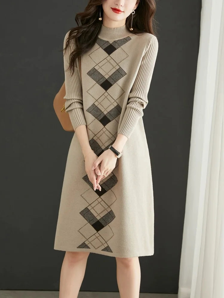 Woman wearing a beige sweater dress with a geometric pattern on a dark background