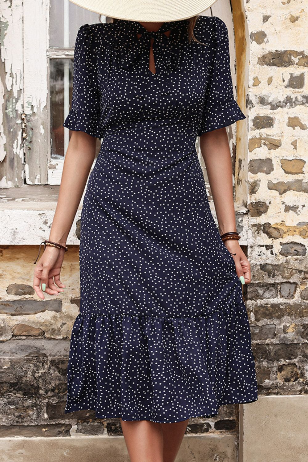 Woman wearing Navy Polka Dot Tie Front Ruffled Midi Dress