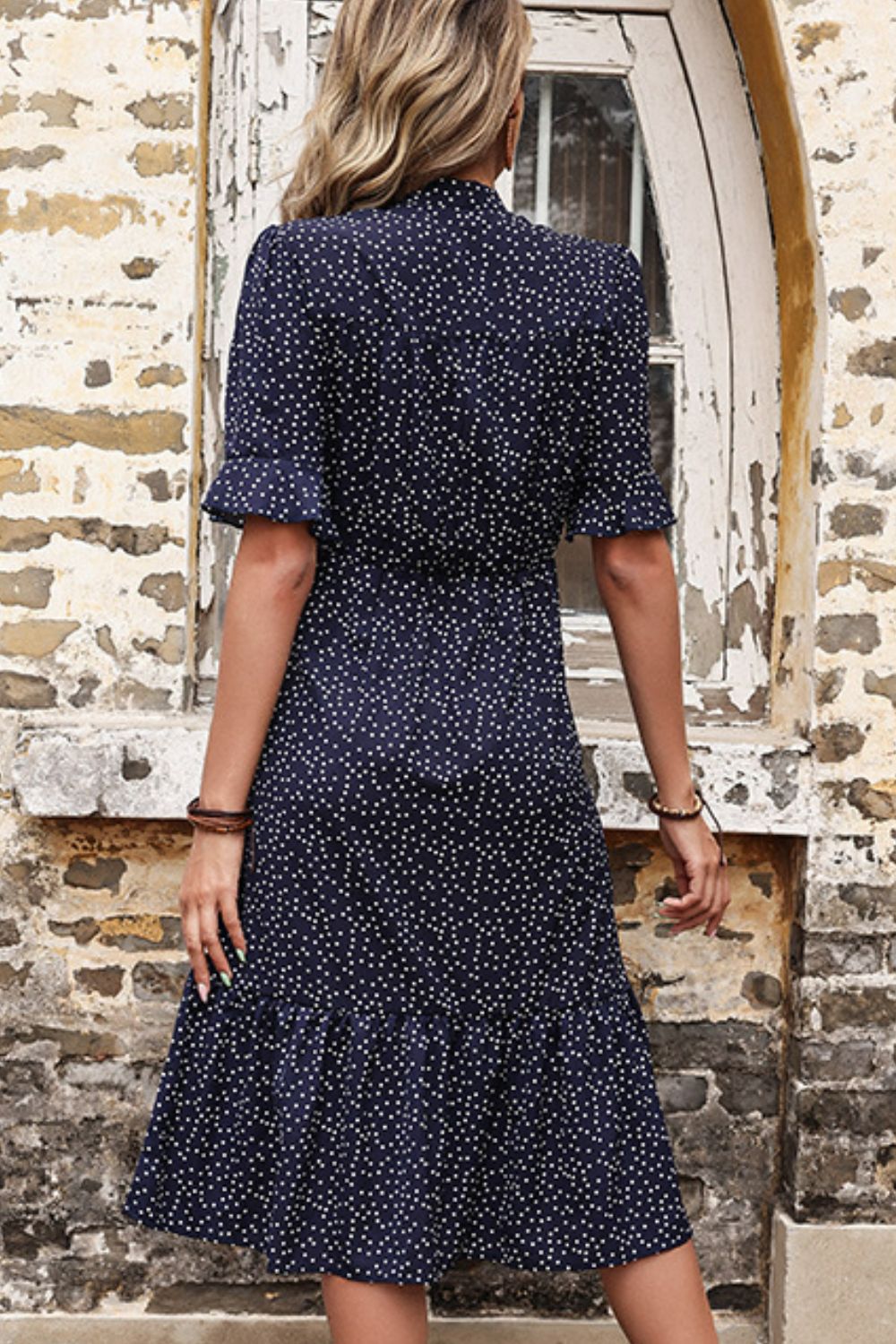 Woman wearing Navy Polka Dot Tie Front Ruffled Midi Dress