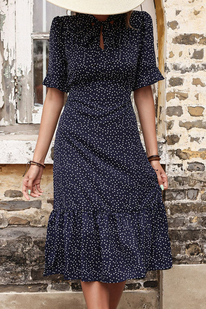 Woman wearing Navy Polka Dot Tie Front Ruffled Midi Dress