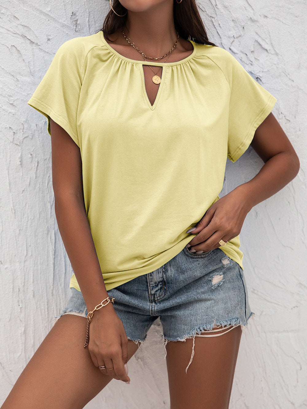 Woman in Yellow Cutout Round Neck T-Shirt