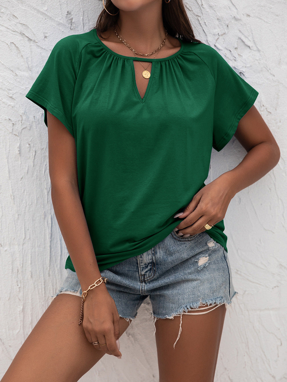 Woman in Green Cutout Round Neck T-Shirt