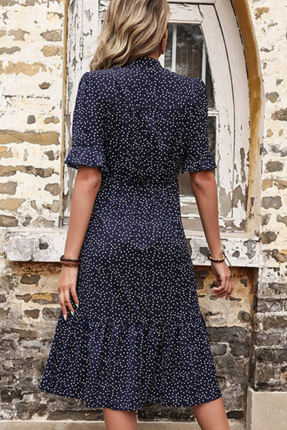 Woman wearing Navy Polka Dot Tie Front Ruffled Midi Dress